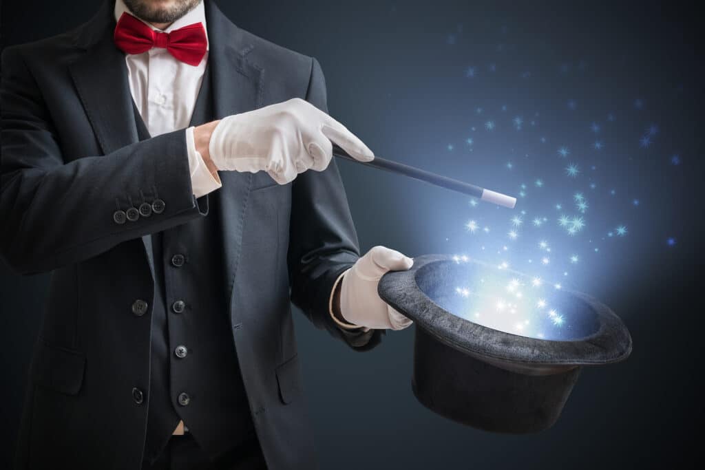 Magician with magic wand and top hat