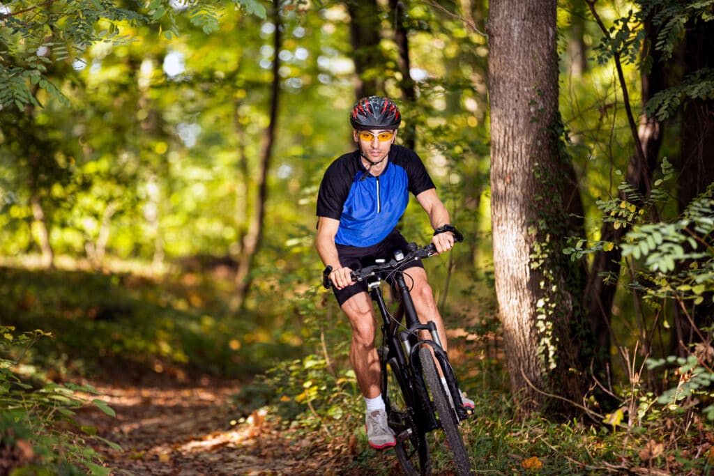 Man on mountain bike in forest