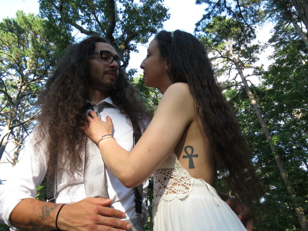 bride and groom outside looking at each other