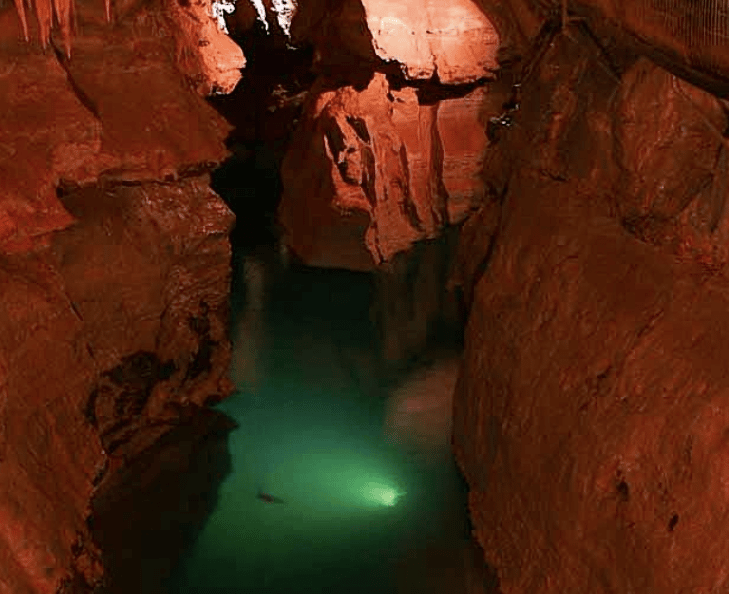 cave walls with water at the bottom