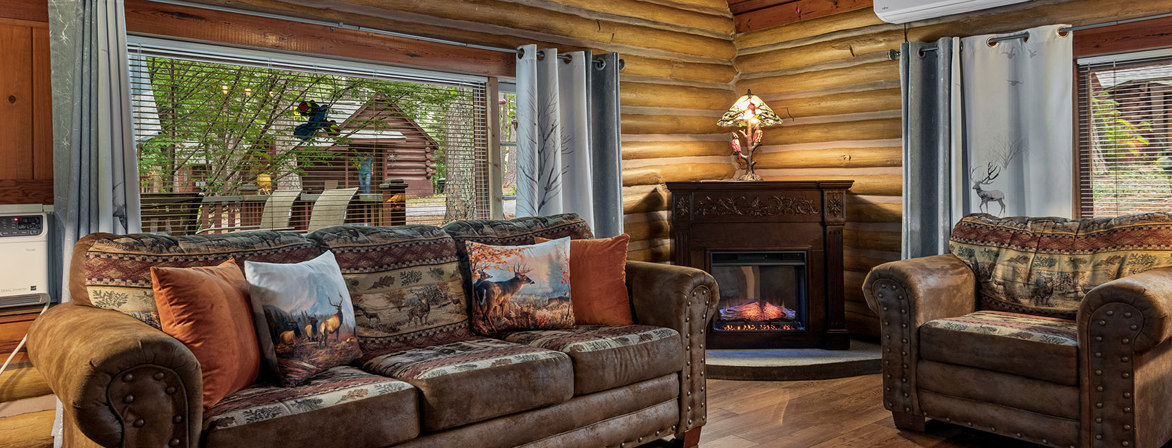 Log Suite sitting area and fireplace